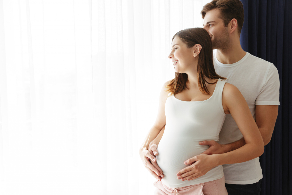 Man hugs his pregnant wife