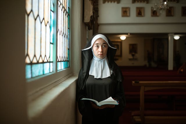 A Nun Holding a Bible